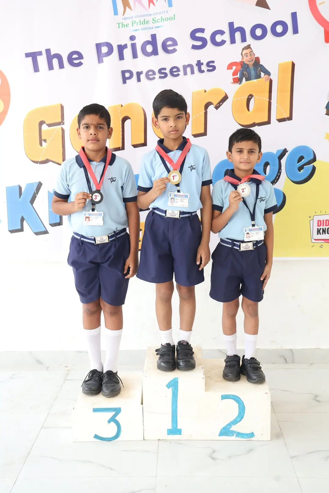 Children from Pride School receiving awards for their outstanding performance in various events, celebrating their success and talent.