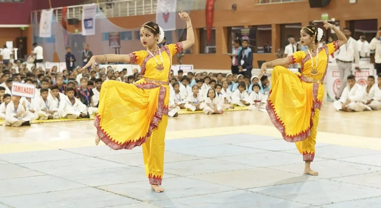 Two girls performing Kathak dance at the Pride School cultural show, showcasing traditional Indian art and culture.