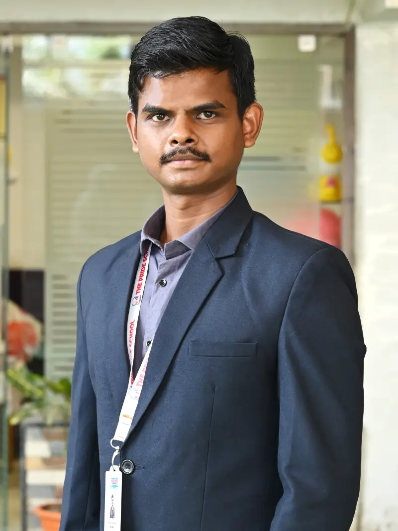 A teacher from Pride School, exemplifying dedication and commitment to quality education and mentoring students.